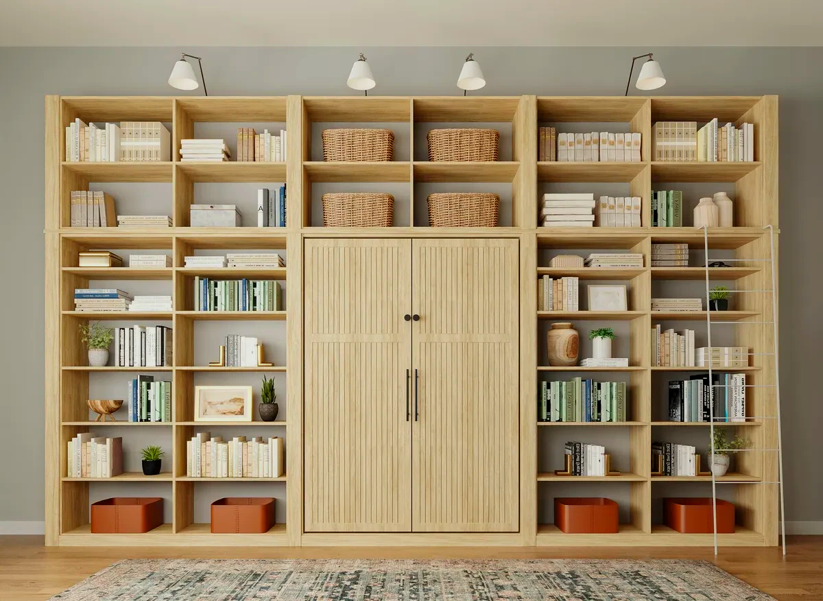A large wooden bookshelf filled with books and baskets in a living room.