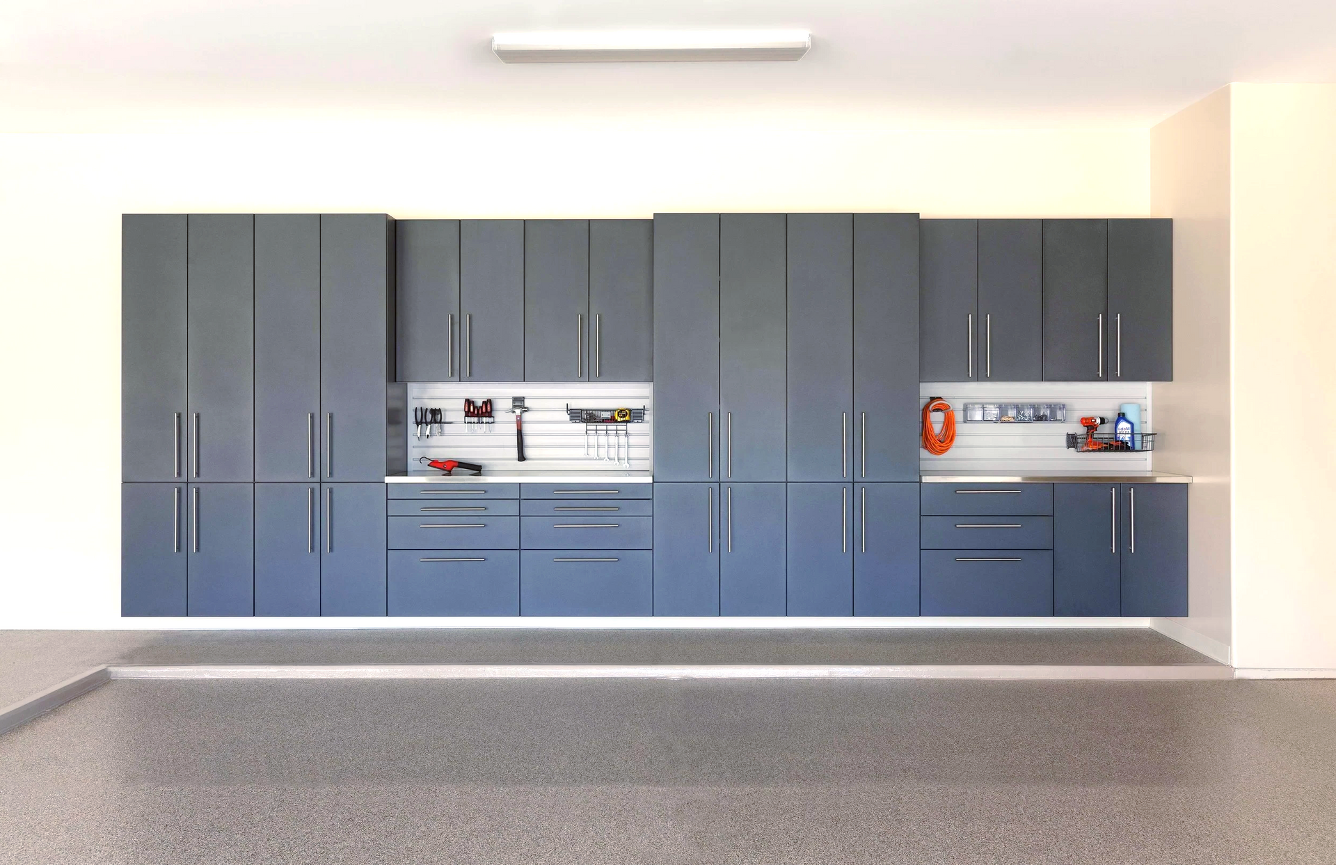 A garage with a lot of cabinets and drawers.