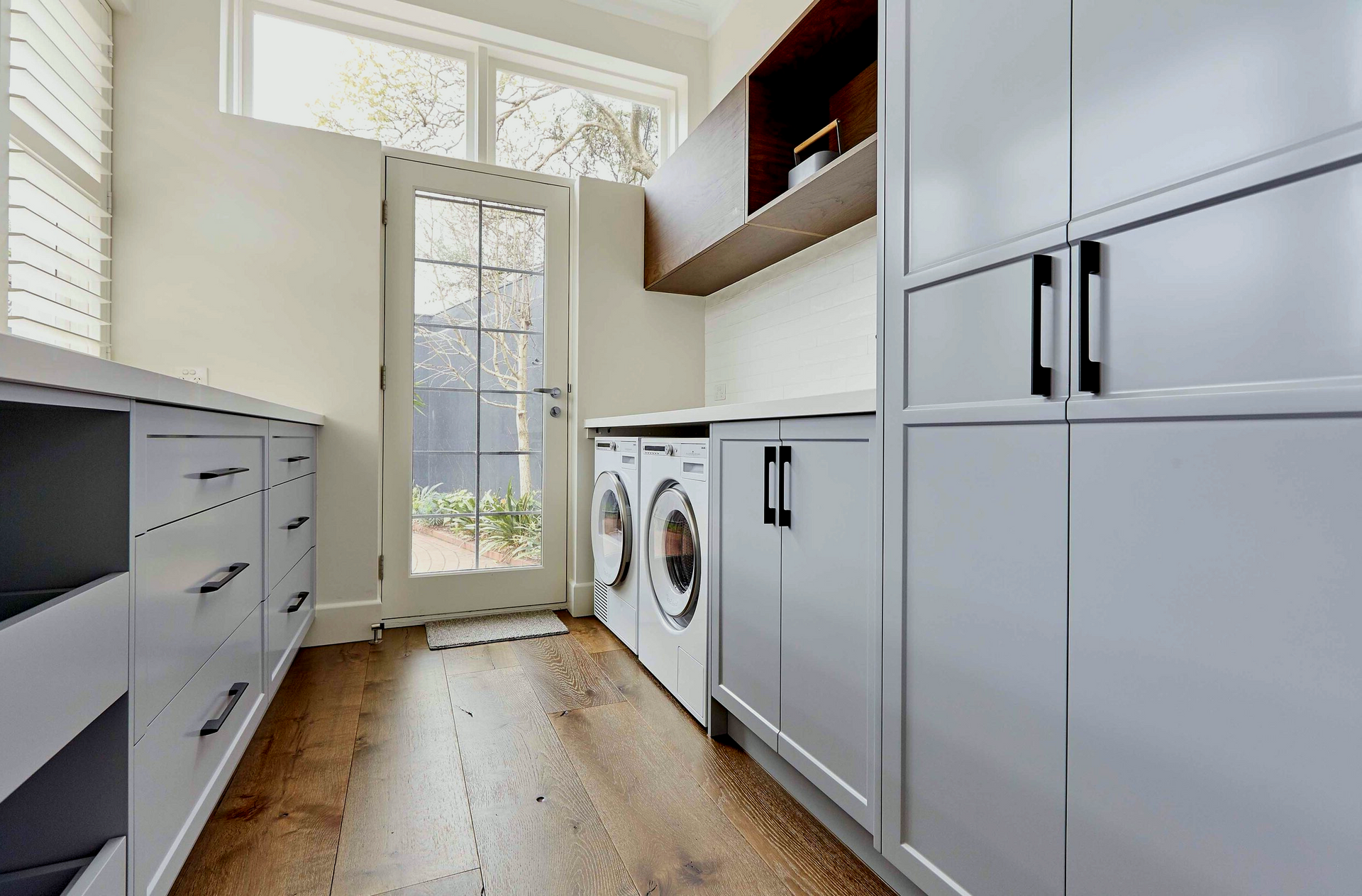A laundry room with a washer and dryer in it.