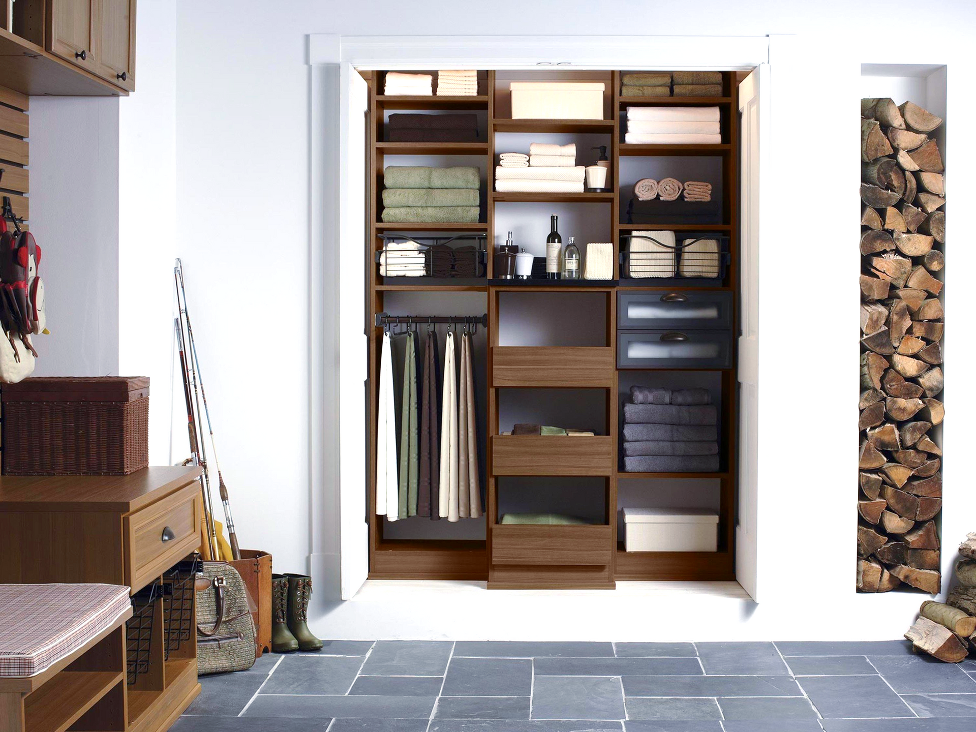 A closet with a lot of shelves and drawers.