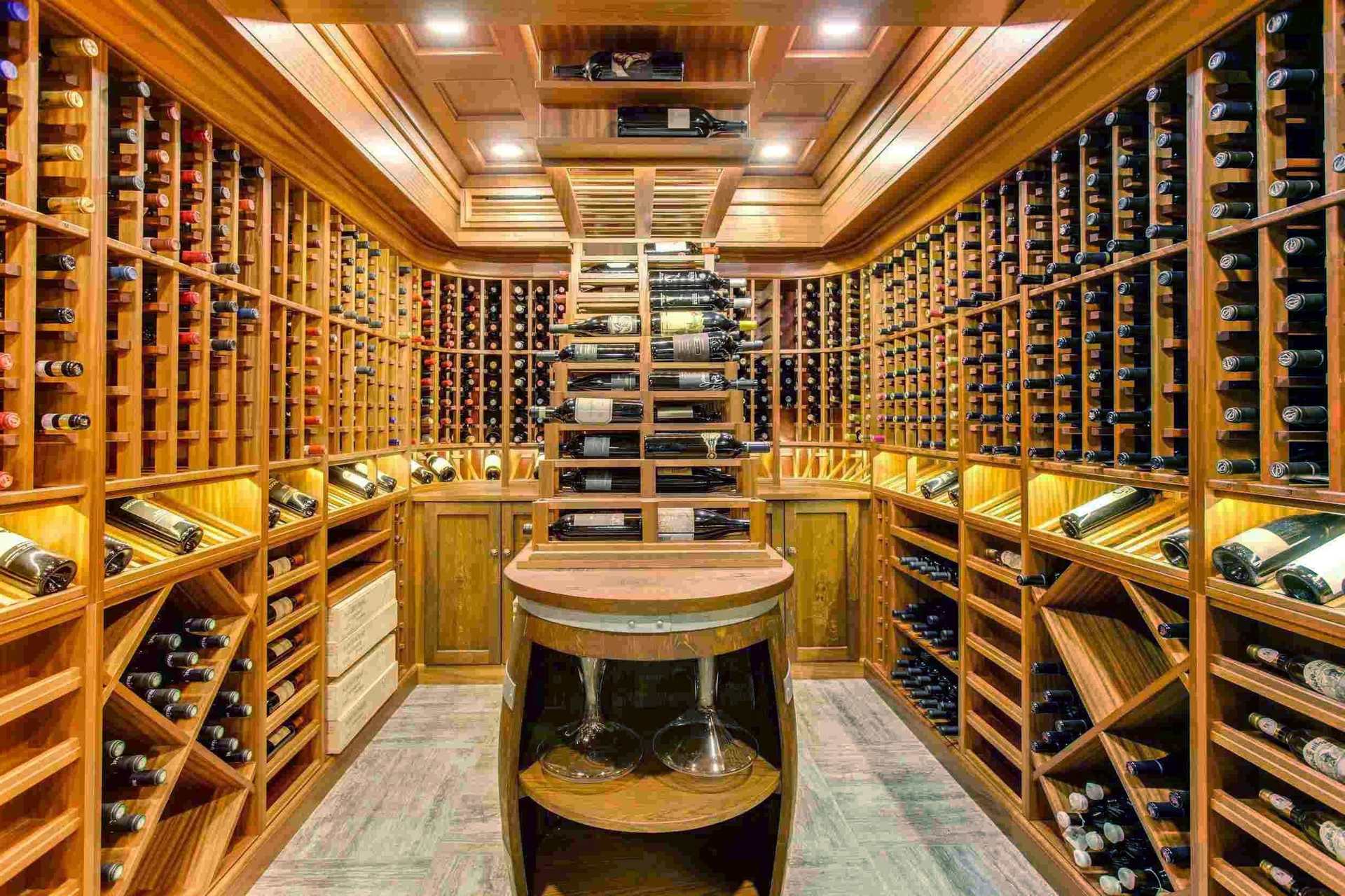 A large wine cellar filled with lots of bottles of wine.