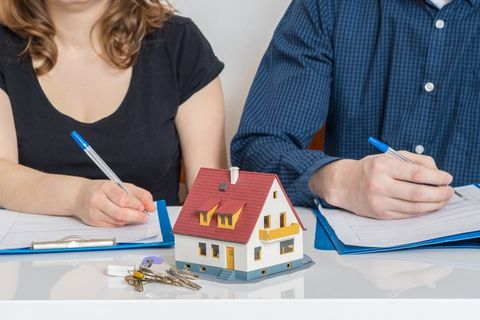 Divorce Attorney — Man and Woman Dividing a Property in Colorado Springs, CO