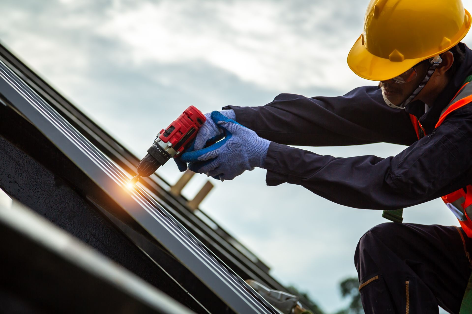 Roofer worker in protective uniform. Roofer worker in protective uniform.