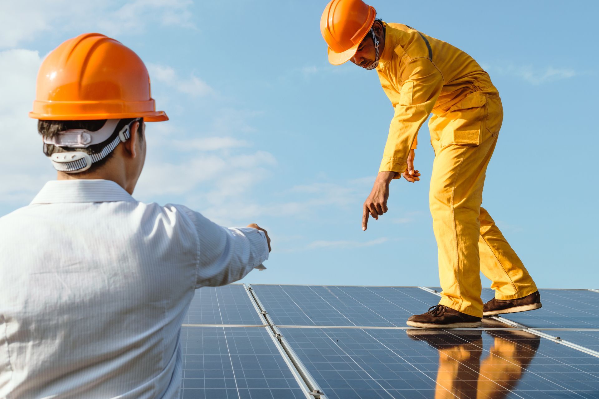 Ross Roofing's expert engineers checking residential solar panel installation | Monterey, CA