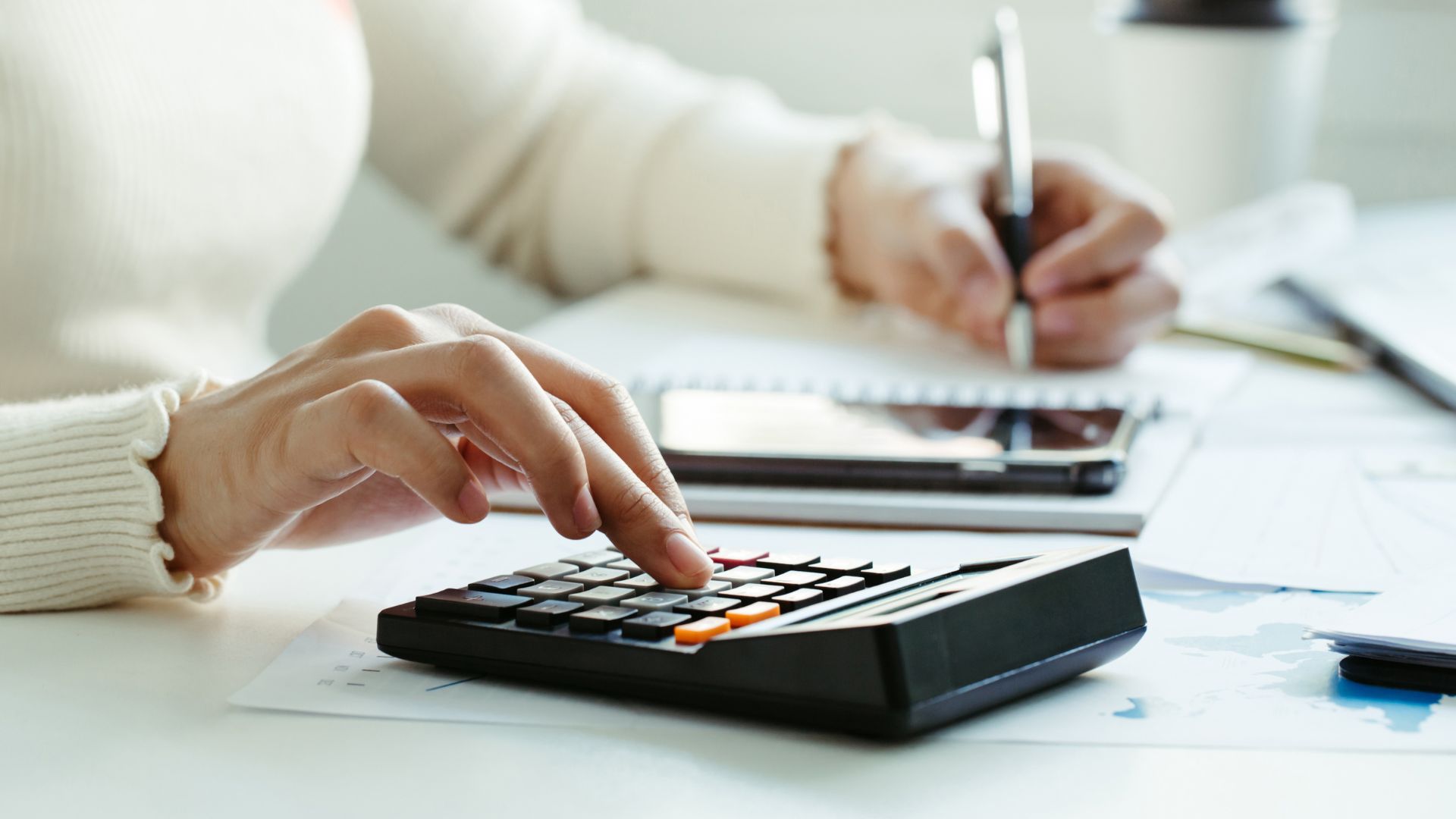 an acountant calculating sole trader vs limited ocmapny tax