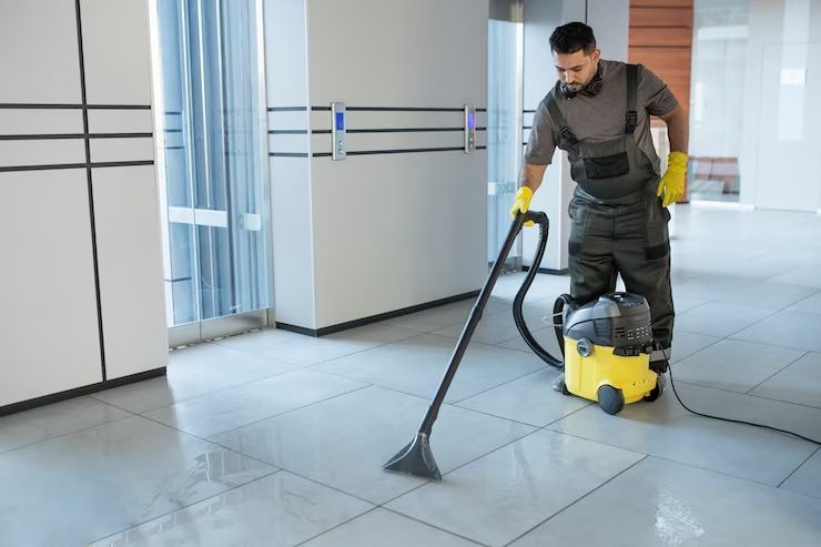 Man Cleaning Floor Using Vacuum - Cleaning Services in Darling Downs, QLD