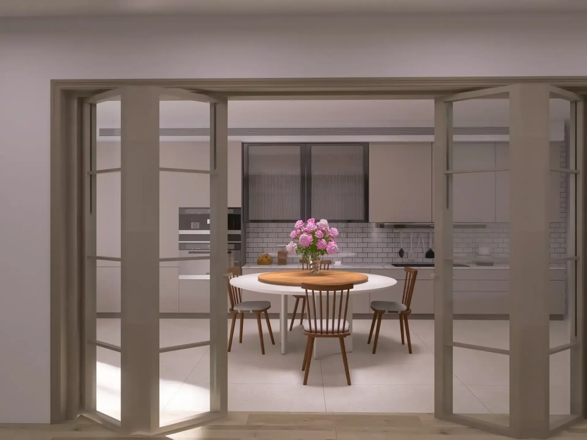 Beige bifold doors open to a kitchen with a round table, chairs, and flowers.