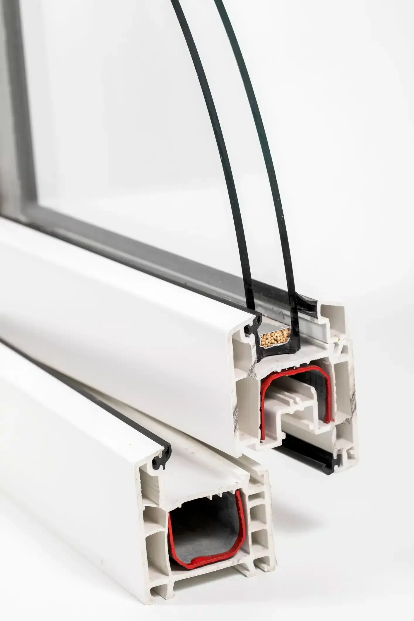 Cross-section of white PVC window frame with double-pane glass, showing insulation and seals.