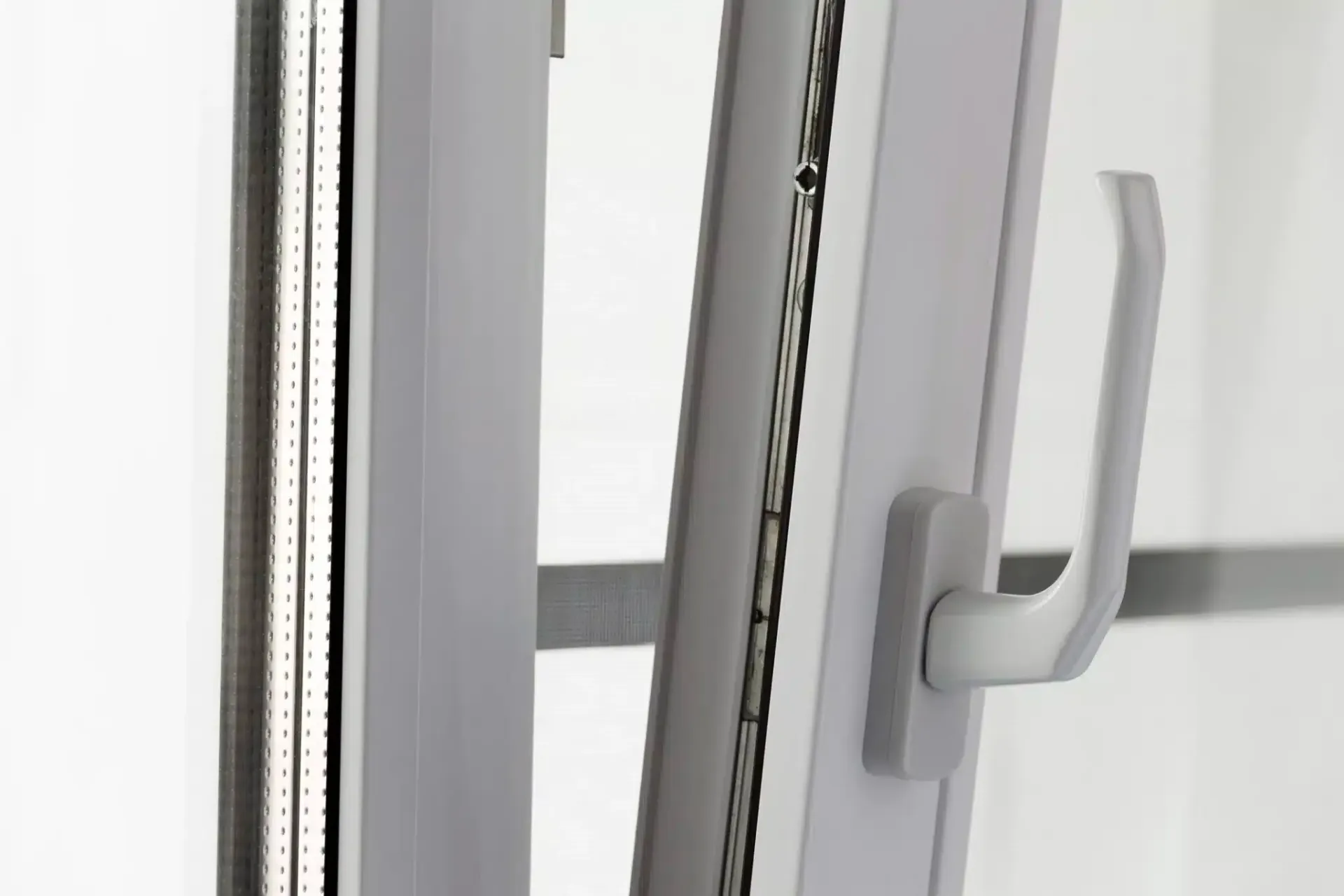 White window with a handle being turned, opening the window.