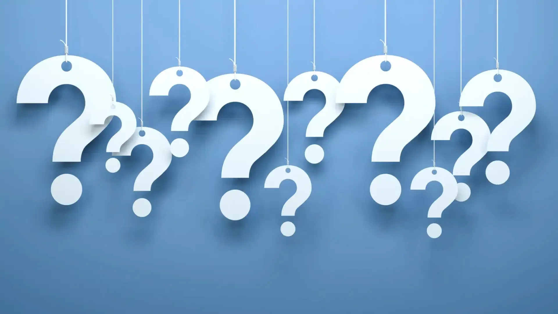 White question marks suspended against a light blue background.