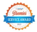 Premier Service Award 2022 seal with orange sunburst border, blue banner, and text.