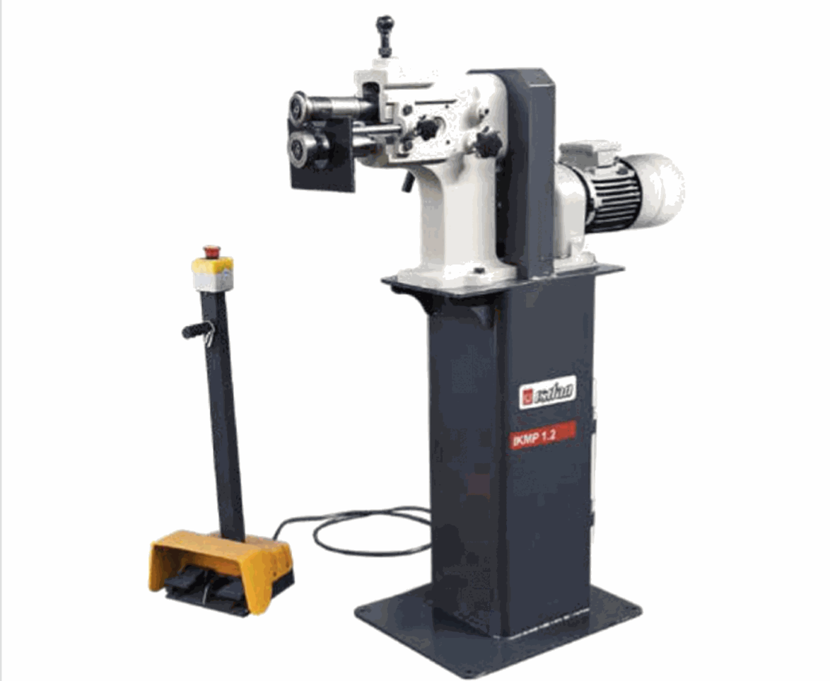 A machine is sitting on top of a white table.