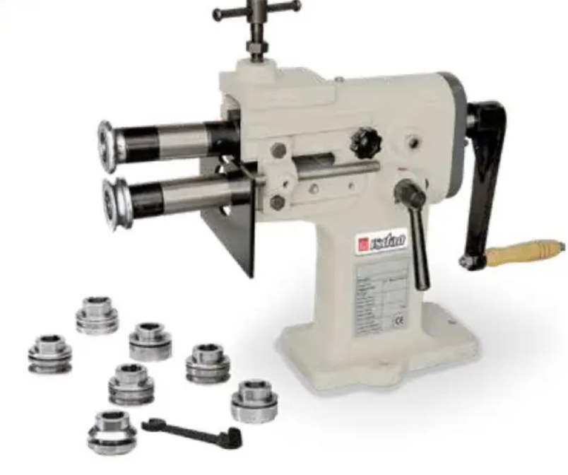 A machine with a wooden handle is sitting on a table.