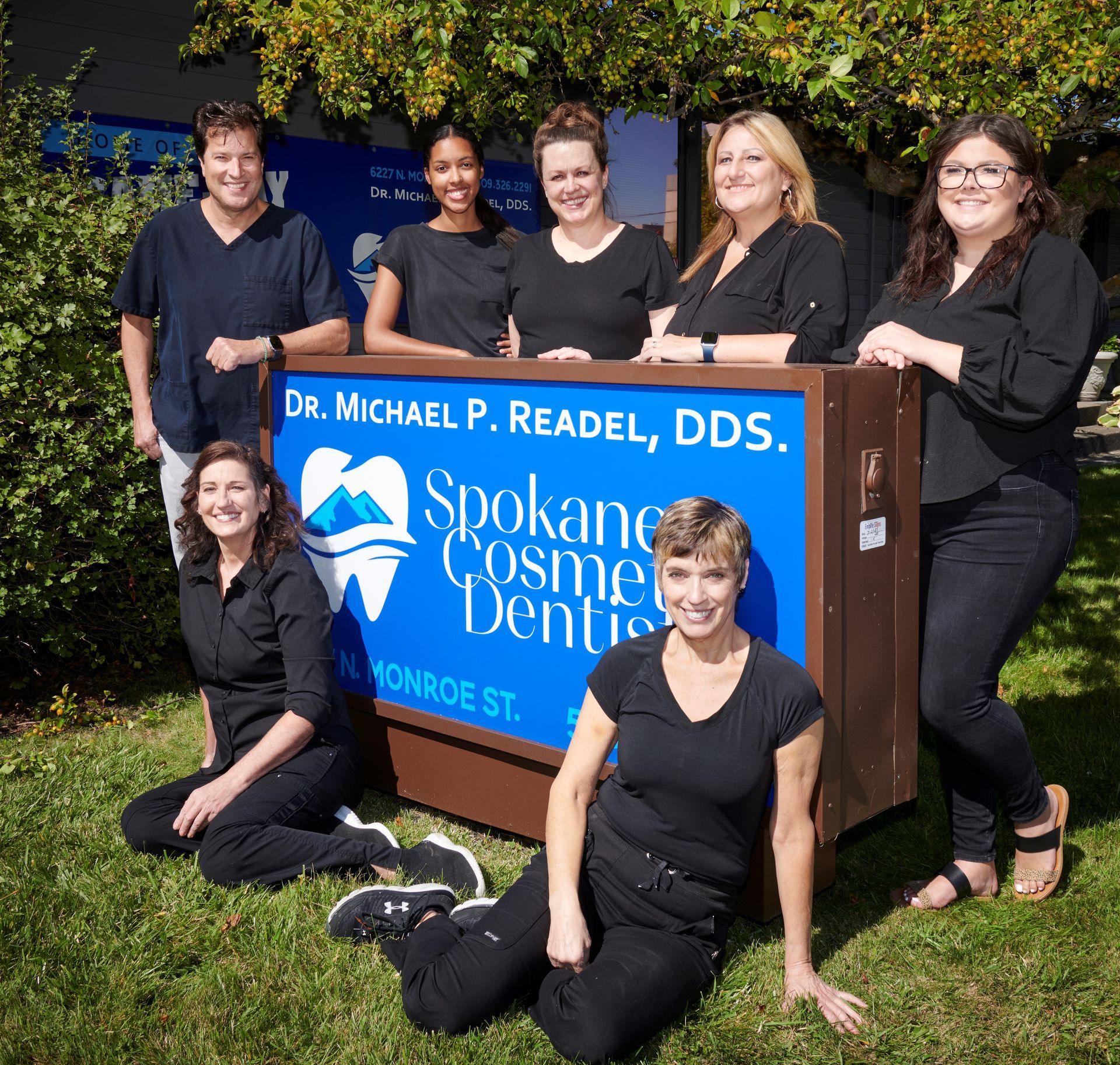 Dental Staffs Image With The Business Signage — Spokane, WA — Dr. Michael Readel, D.D.S.