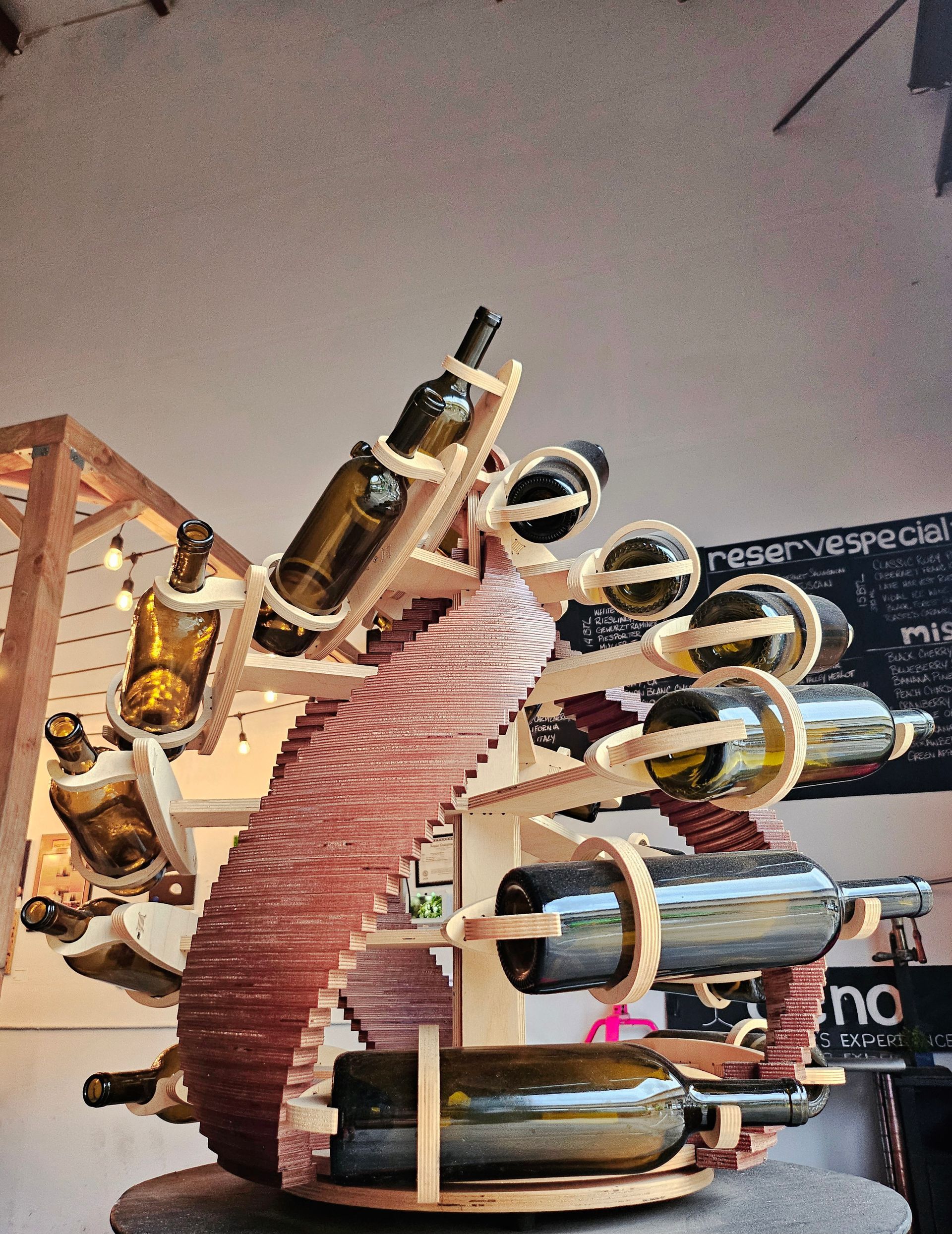 A Wooden Wine Rack With Bottles Of Wines | Kailua, HI | Oeno Winemaking