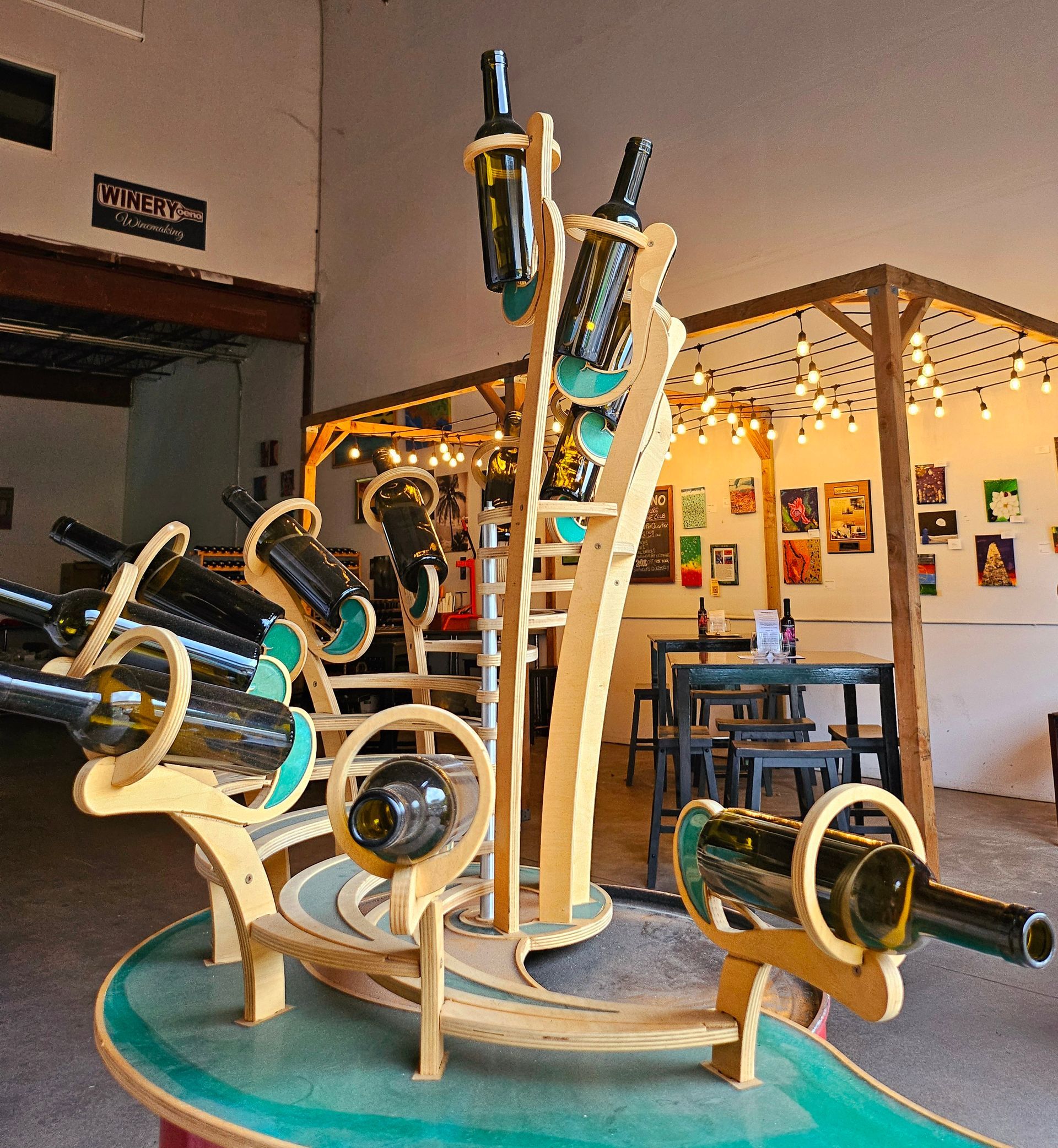 A Wooden Sculpture With Bottles Of Wine | Kailua, HI | Oeno Winemaking