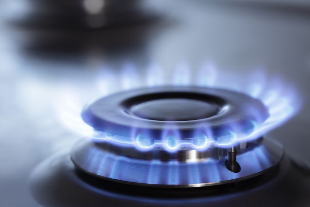 Blue Flame Burning on a Gas Stove Burner  — Holders Electrical In Tenterfield, NSW 