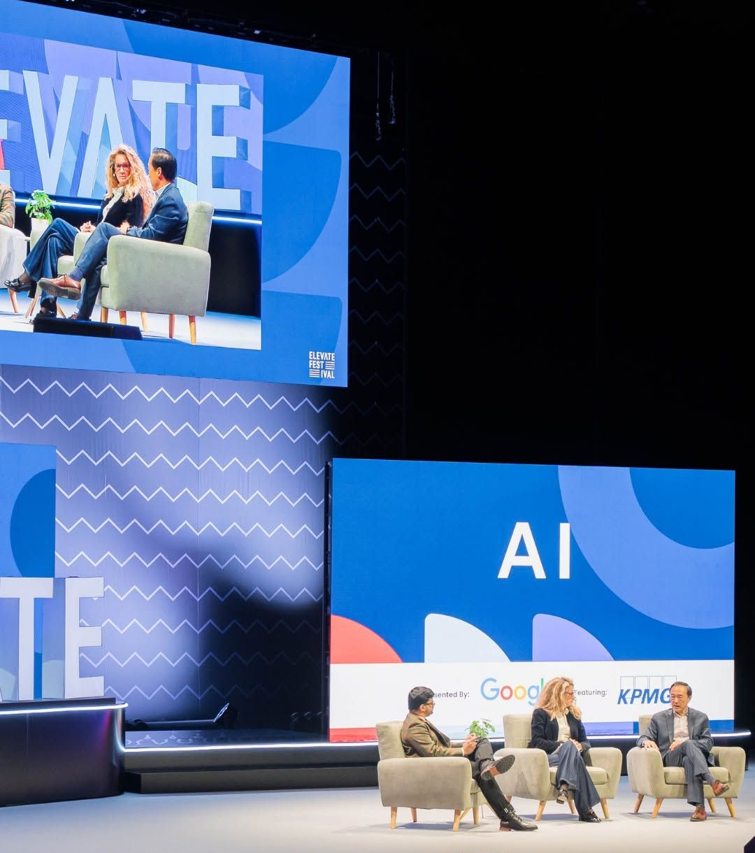 Speakers on stage discussing AI at Elevate 2025