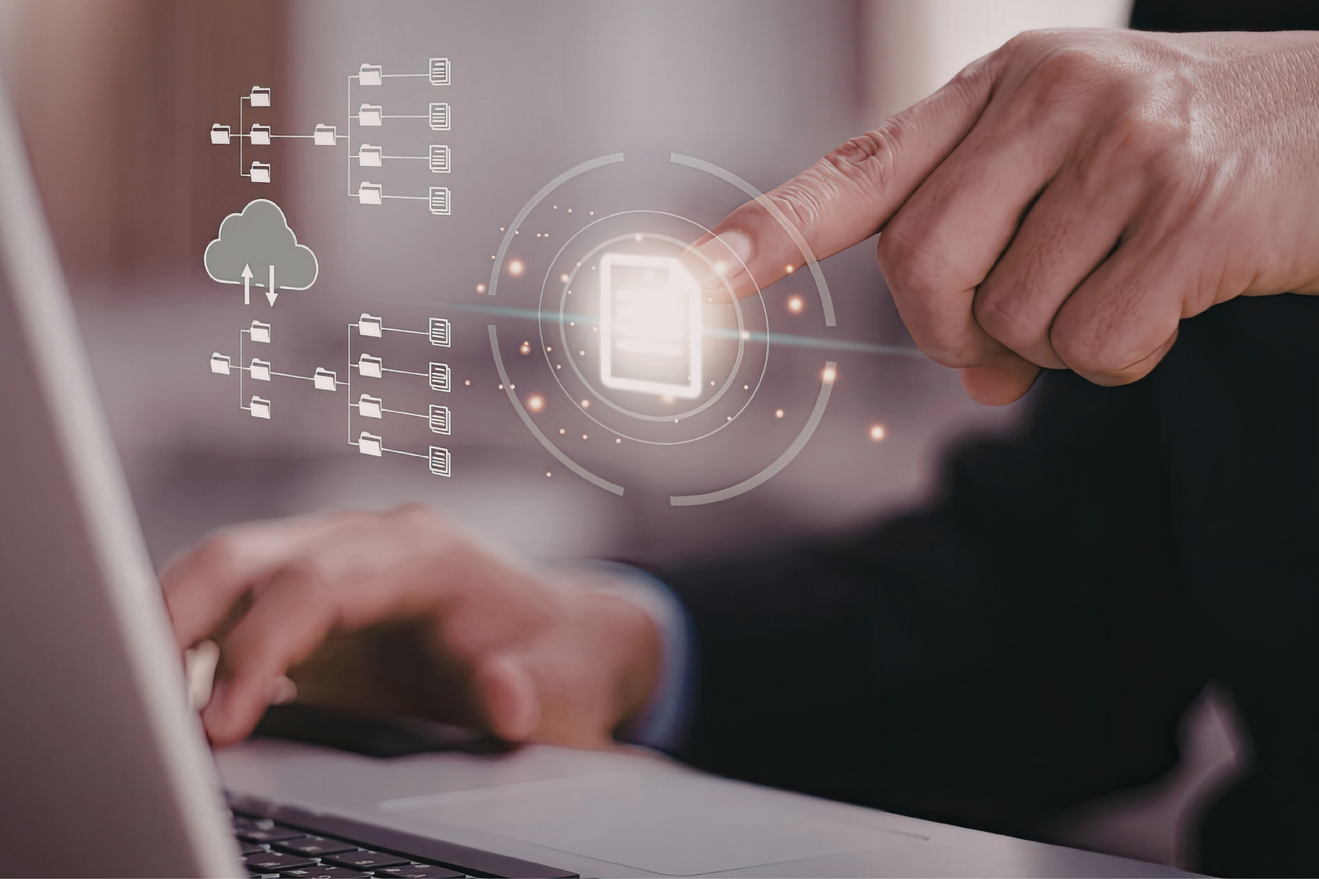 Hands arranging colorful gear-shaped puzzle pieces on a desk with charts and a keyboard.