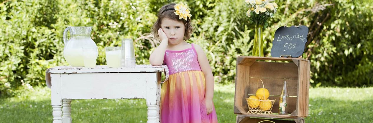 a child selling lemonade