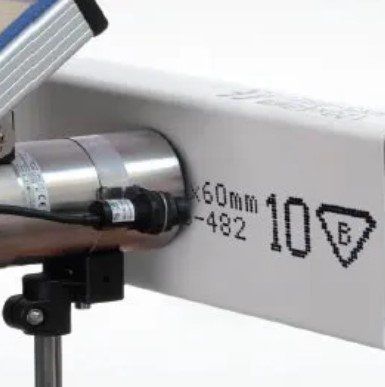 A camera is attached to a white box with the number 10 on it.