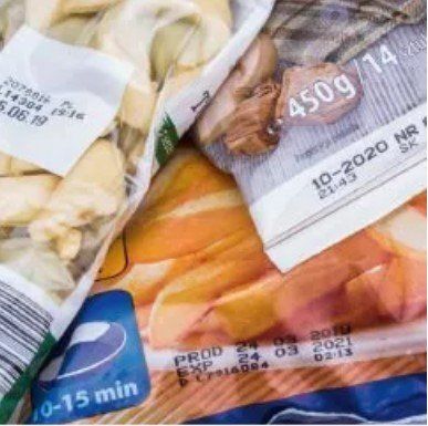 A close up of a package of food with a date stamp on it.