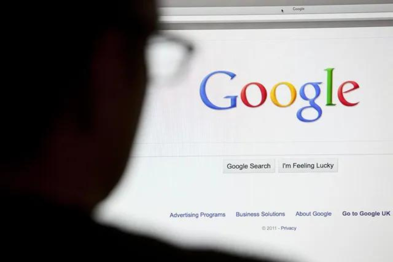 A person is looking at a google page on a computer screen
