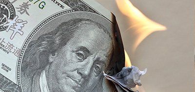 burning banknote - digital marketing agencies often don't give you measurable results