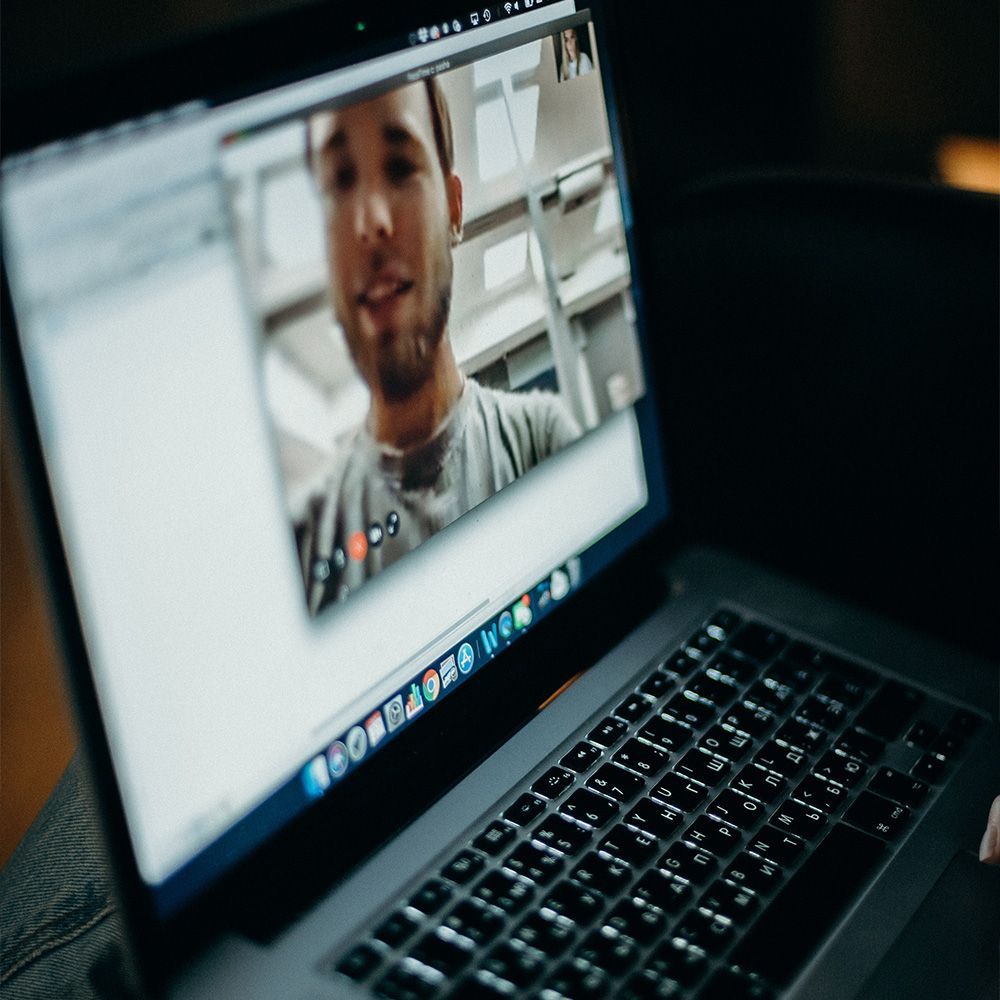 a laptop with a picture of a man on the screen