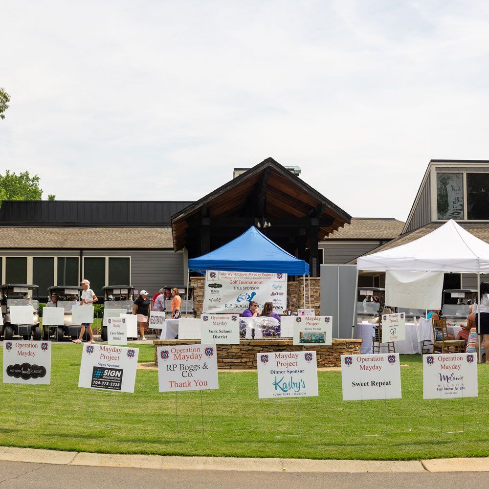Signs in Front of A Building — Lake Wylie, SC — Mayday Project