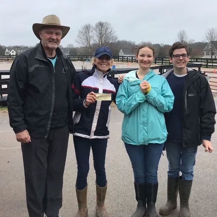 Happy Woman Holding a Check — Lake Wylie, SC — Mayday Project