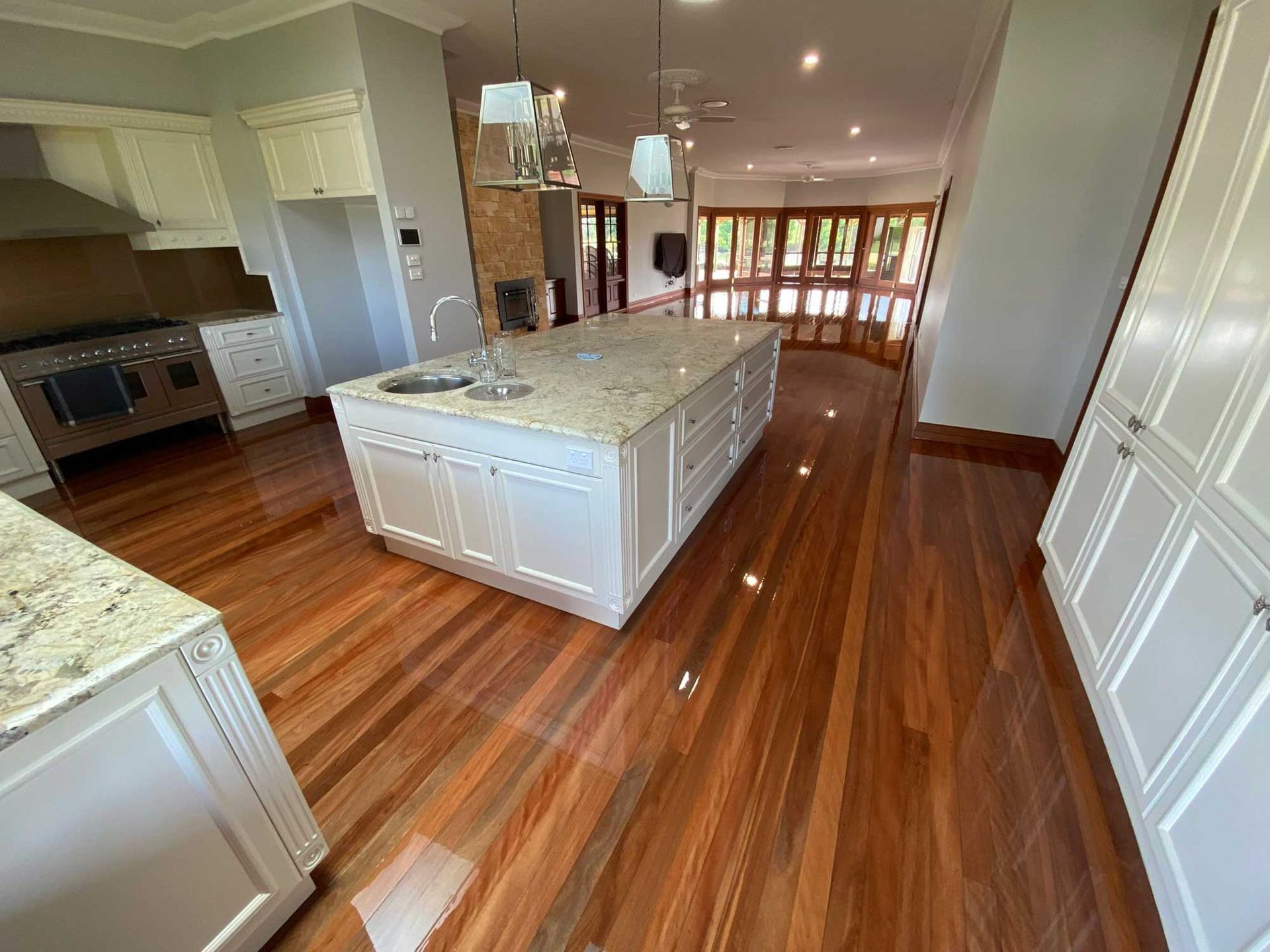 There Is A Large Island In The Middle Of The Kitchen — Brett Hall Floorsanding in Laurieton, NSW
