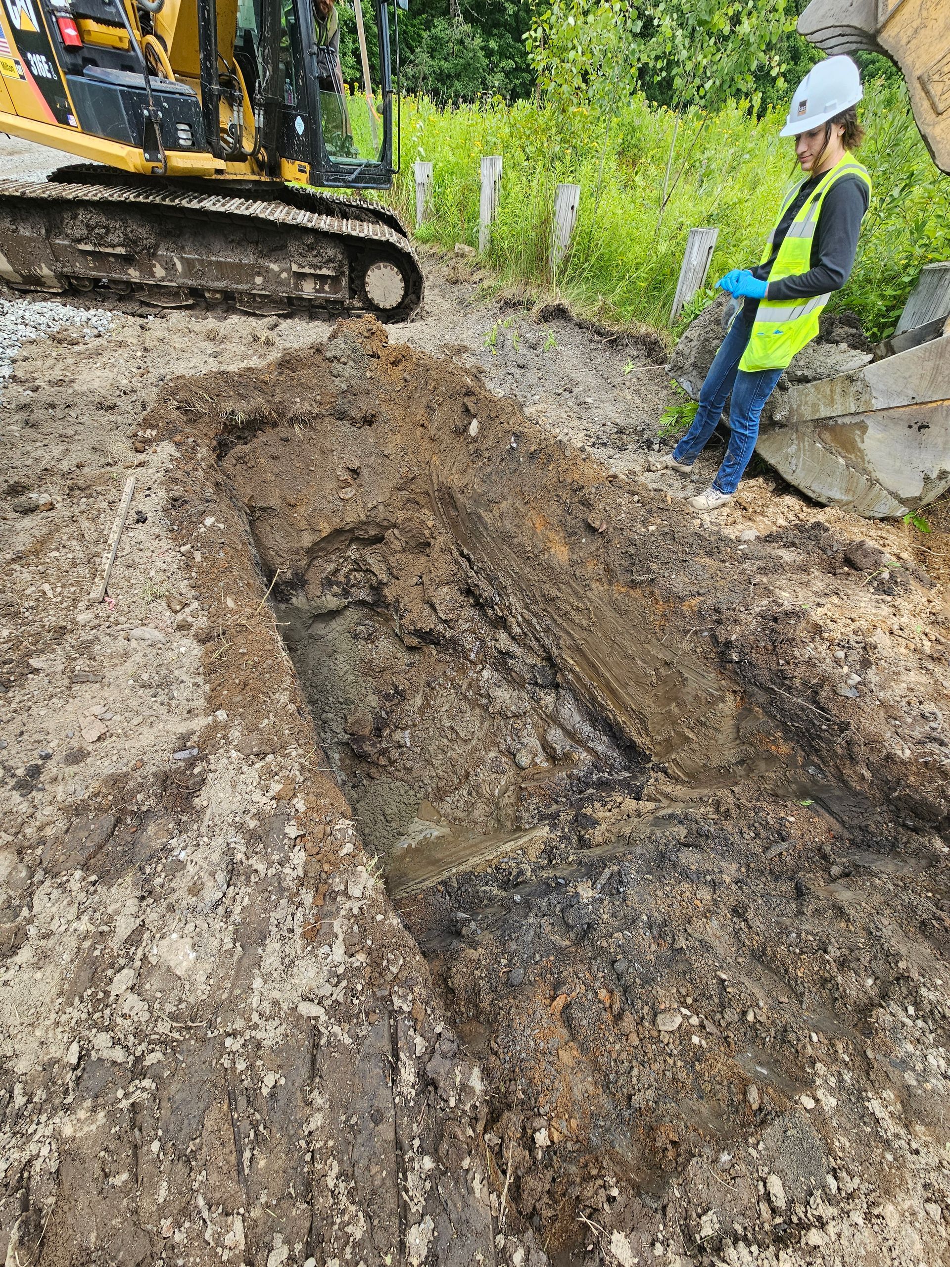 An MP Environmental Services worker standing on part of the Saranac Loft remediation site