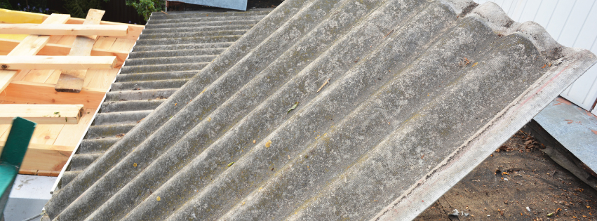 A piece of roofing material covered in asbestos removed by MP Environmental Services