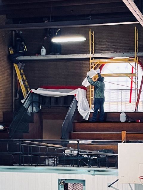MP Environmental employee dressed in satefy equipment working in an asbestos-contaminated facility.
