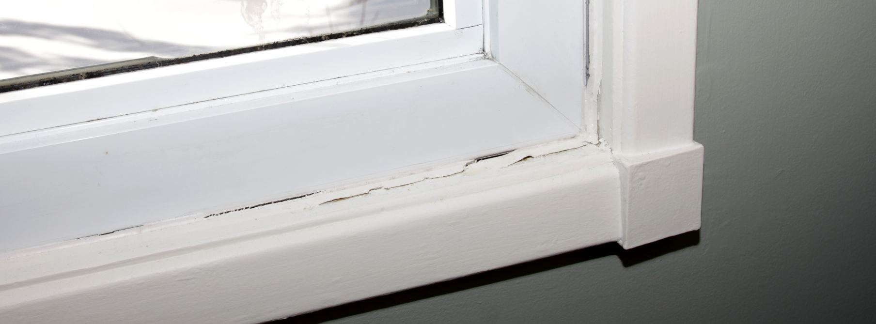 PCB ridden caulking on the windowsill of an old home 