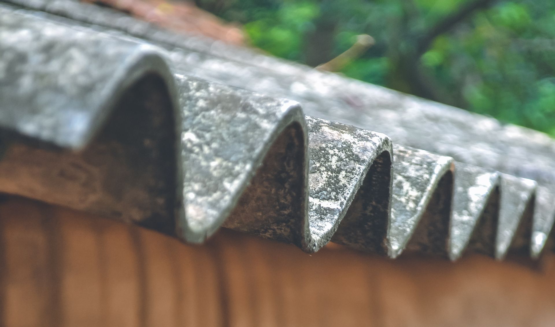 An asbestos roof in New York awaits abatement or encapsulation by MP Environmental Services