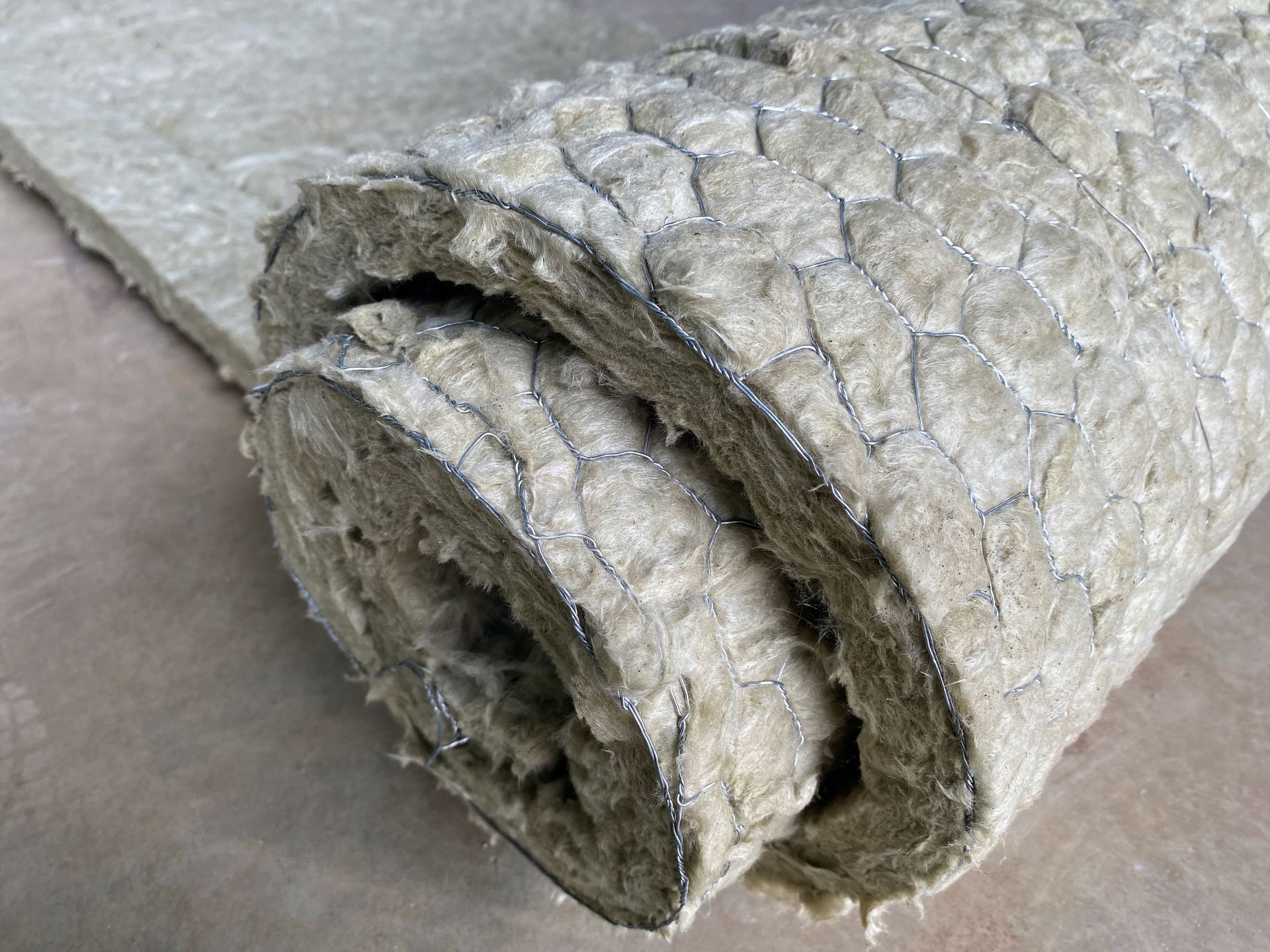 A close up of a roll of asbestos removed from a commercial building by MP Environmental Services.