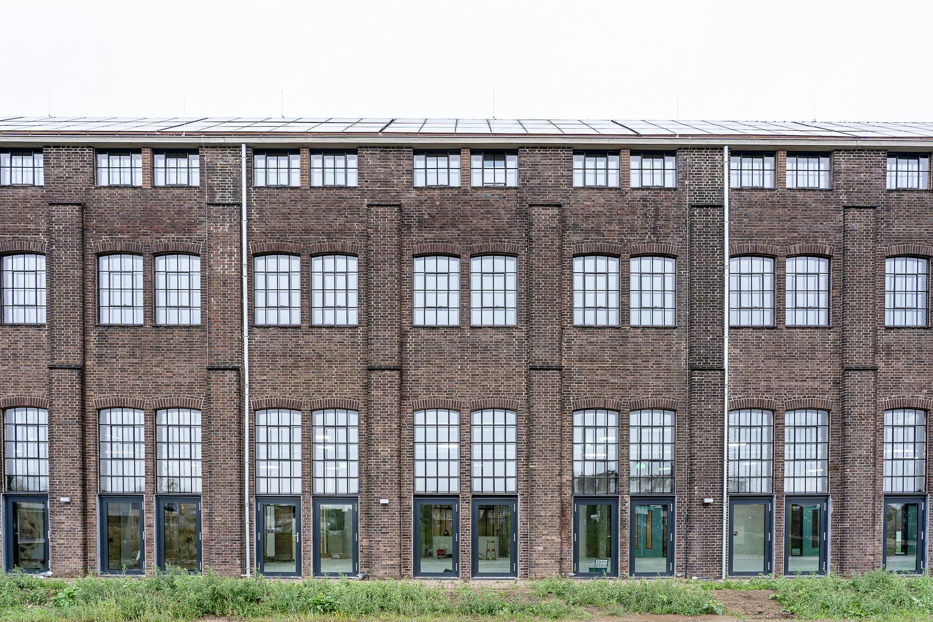 A large historic brick building that has been remediated and restored