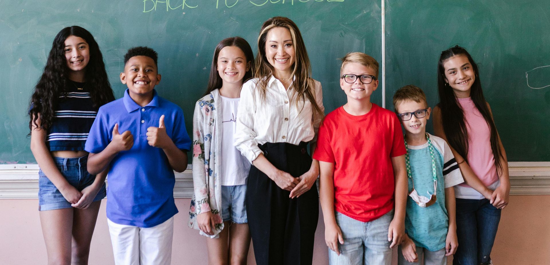 A teacher and her students stand in a lead-free classroom in New York