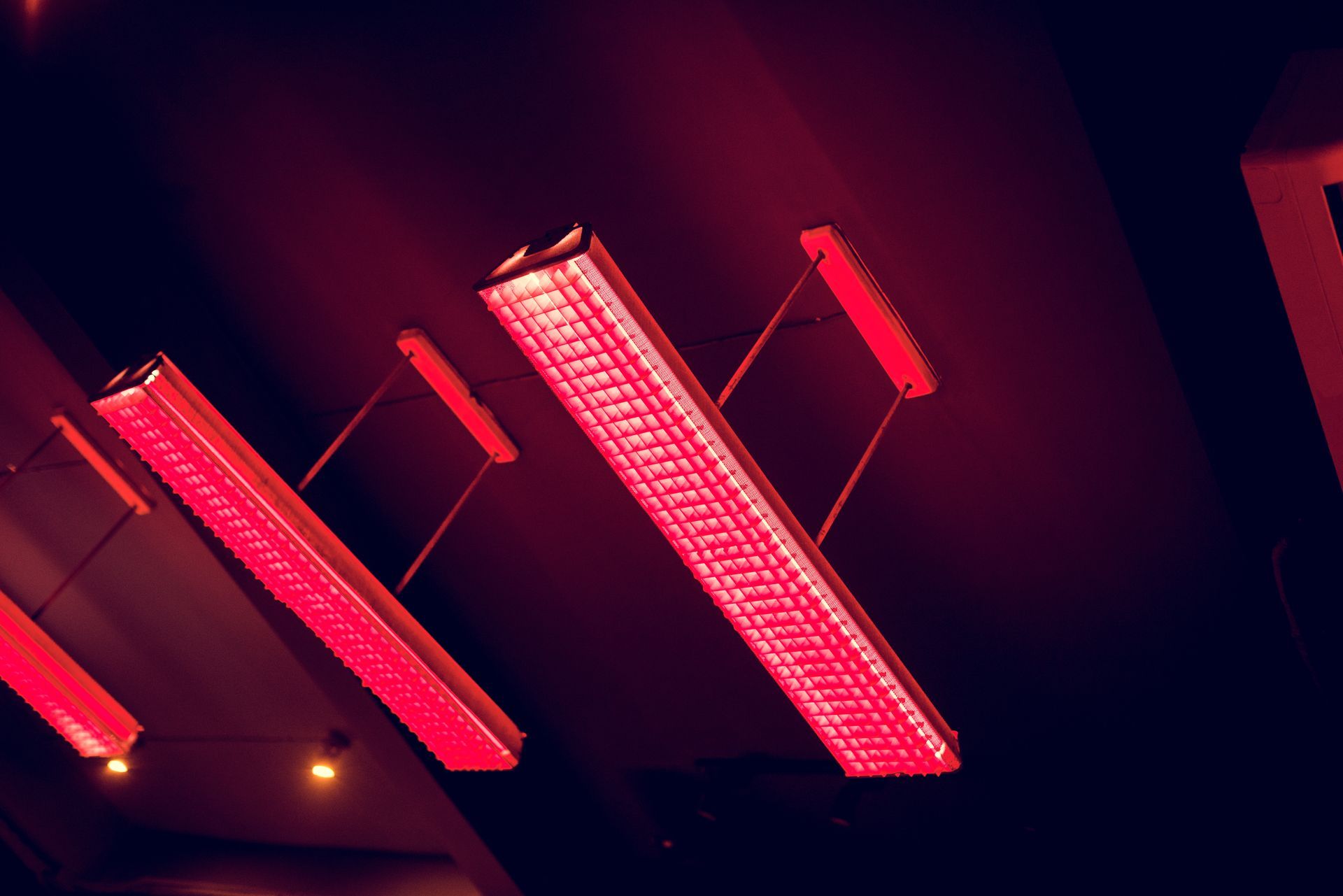 Old flourescent light fixtures contaminated with PCBs hang in a Plattsburgh school