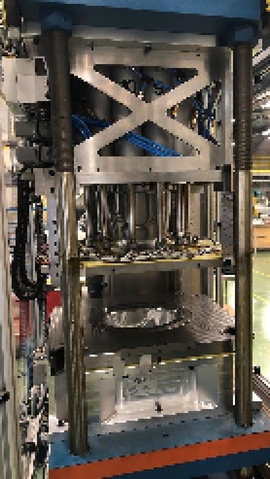 A machine is sitting on top of a table in a factory.