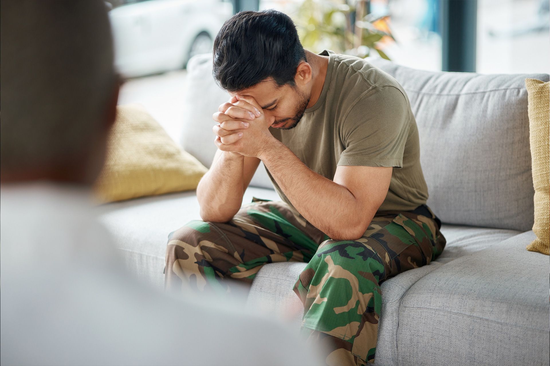 man stressed with PTSD and TBI symptoms related to Defense Base Act claim process