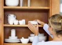 woman in front of a kitchen cabinet