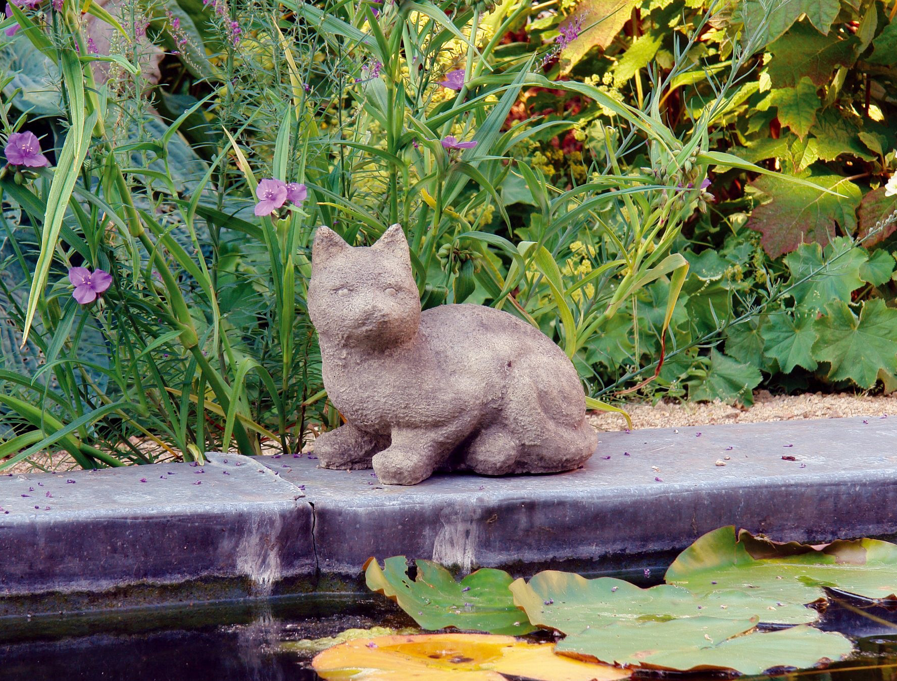 curious cat stone garden statue