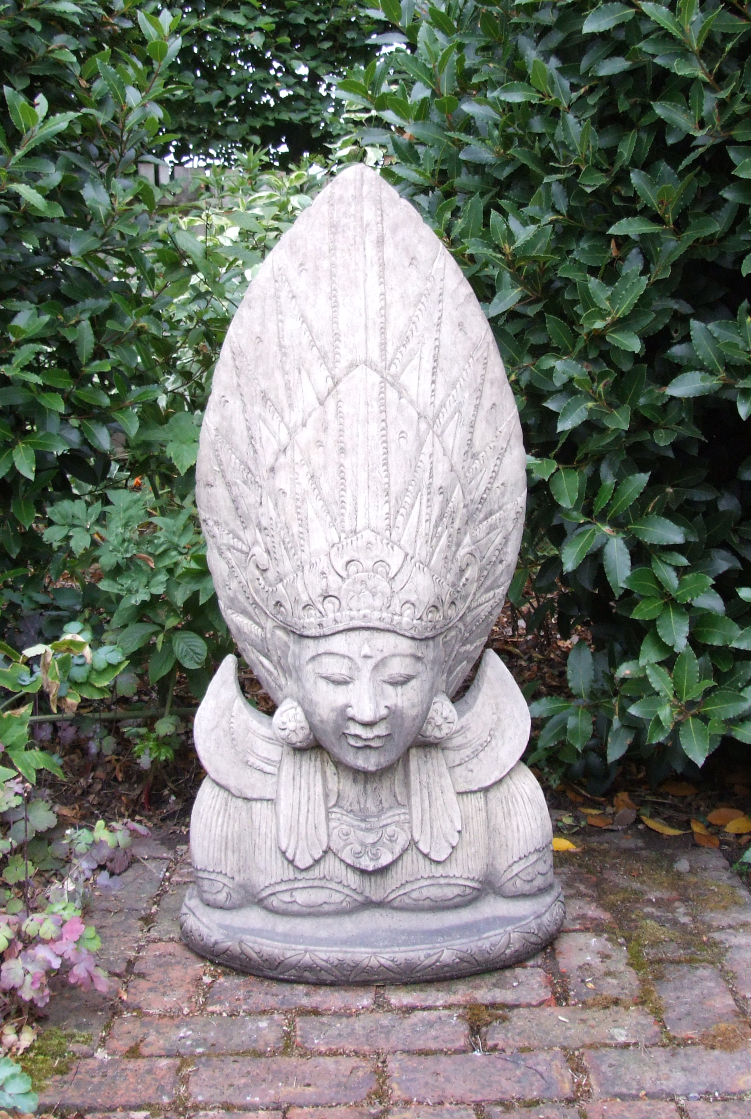 sun god stone garden statue