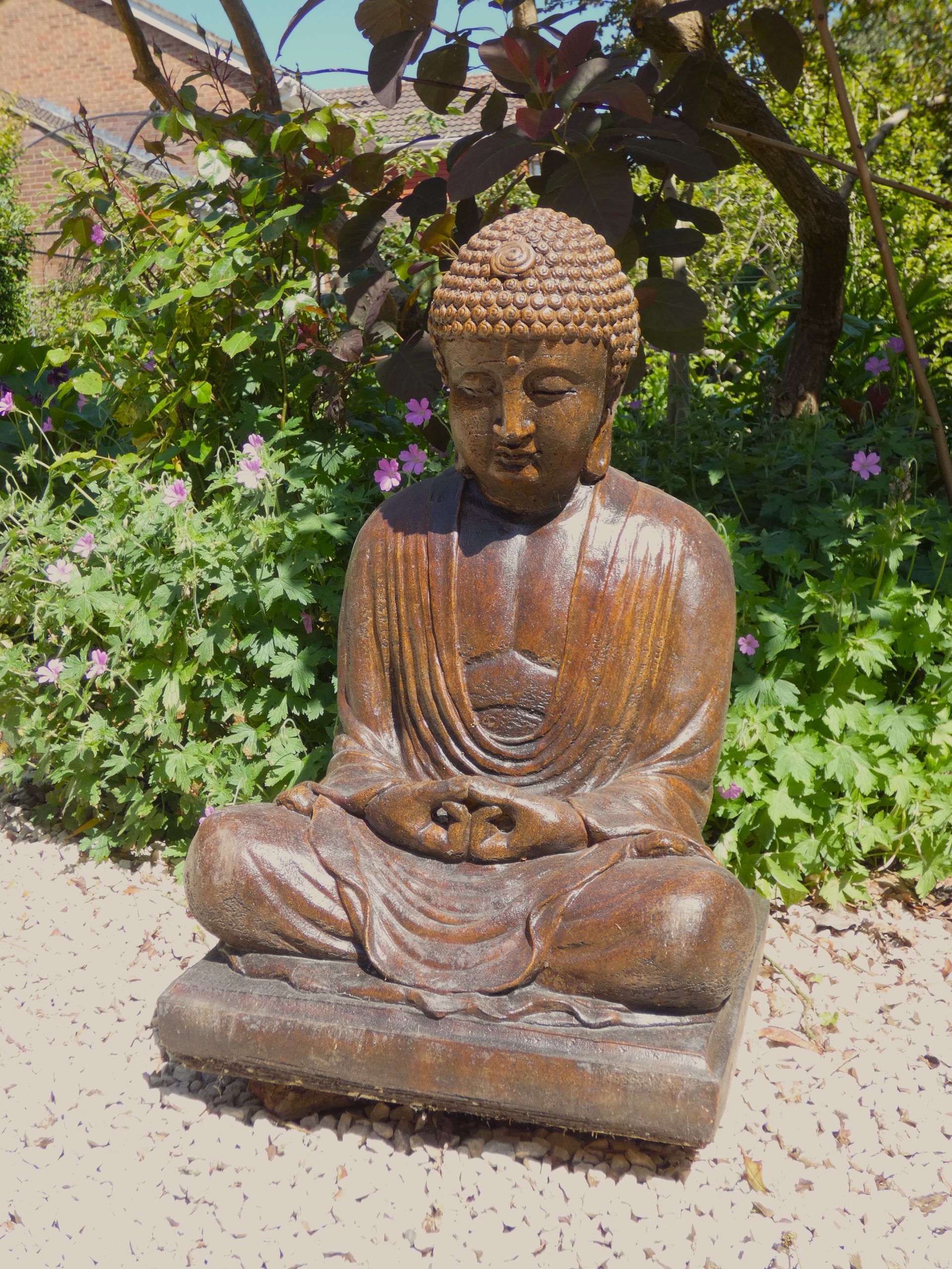 stone garden statue meditating buddha