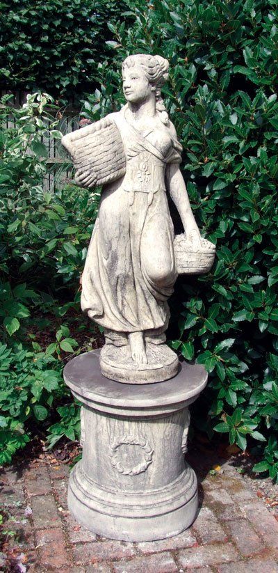 stone garden statue round laurel plinth