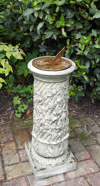 stone garden statue vine aged brass sundial