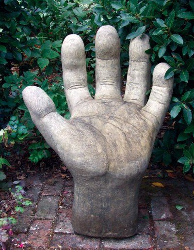 stone garden statue giant hand left